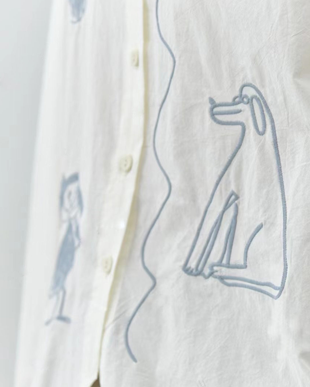 Cotton Shirt with Irregular Hem and Abstract Dog & Figure Embroidery