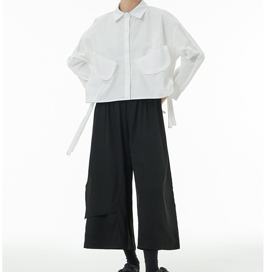In Stock Ruffles Decorated Pockets Back Asymmetric Curvy Cutting Cotton Shirt Available in Black and White