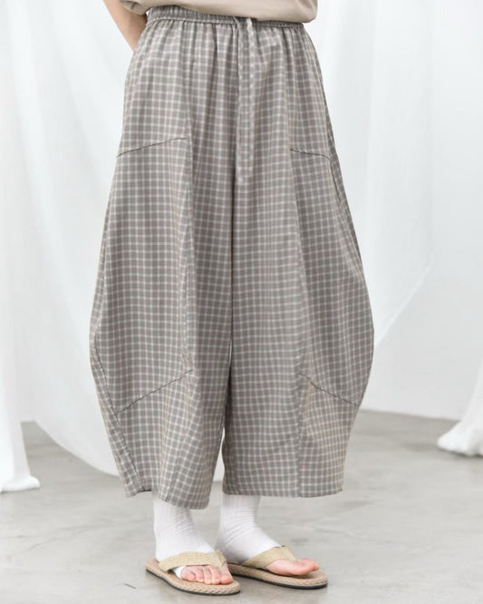 Pre-order Patchwork Check Curved-Leg Trousers