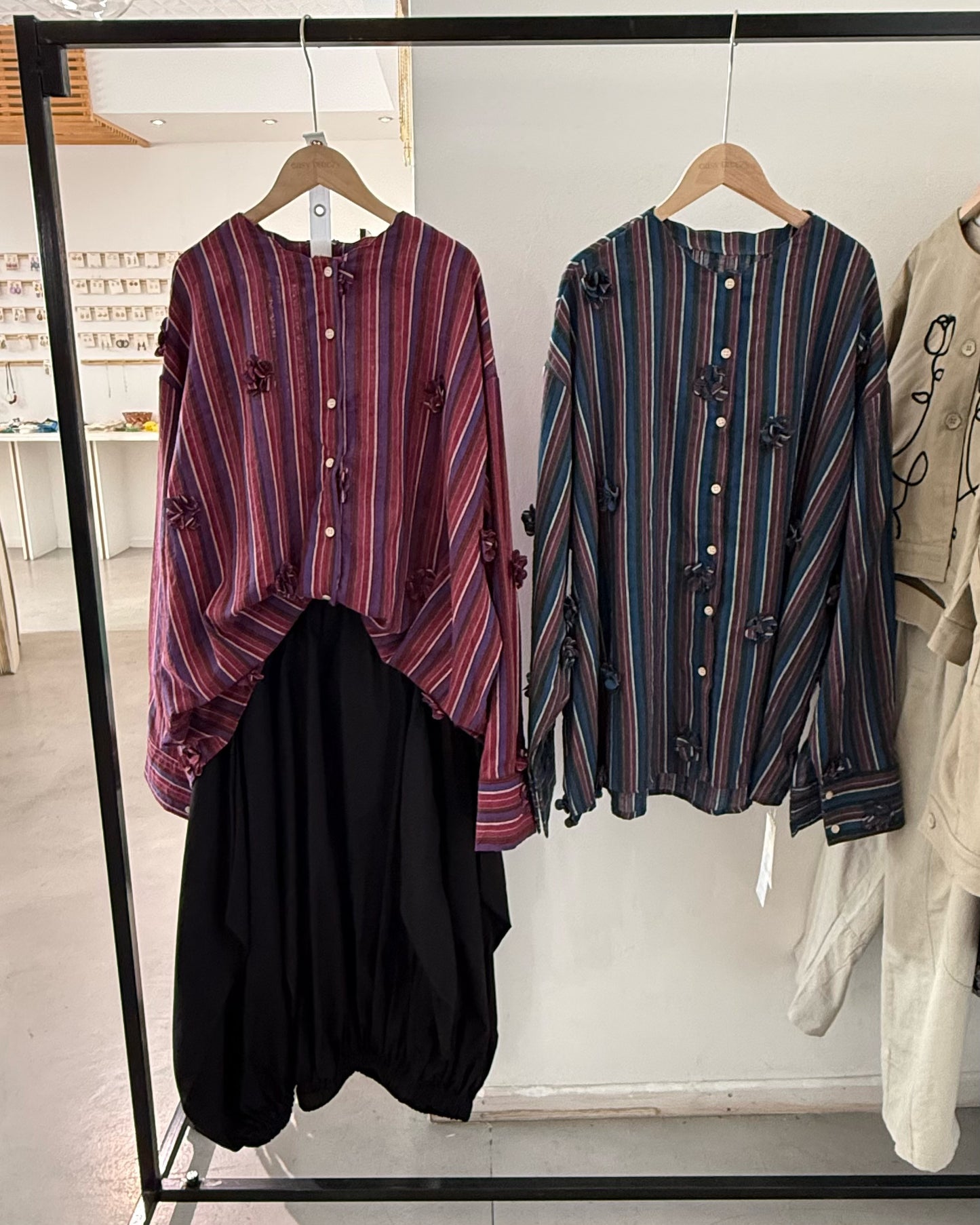 Striped shirt with 3D floral appliqués